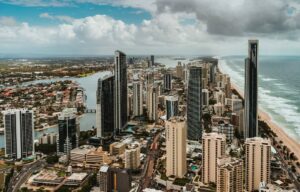 a city with many tall buildings and a body of water