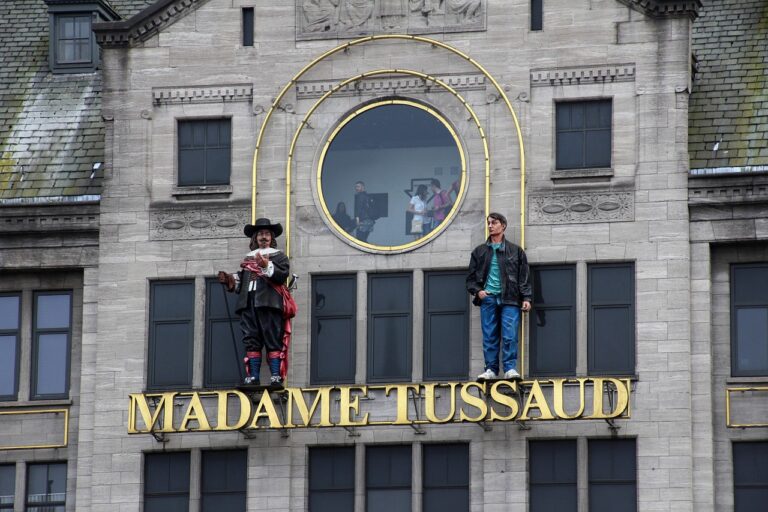 Madame Tussauds Sydney exterior with wax figures of a pirate and a man on top of the building