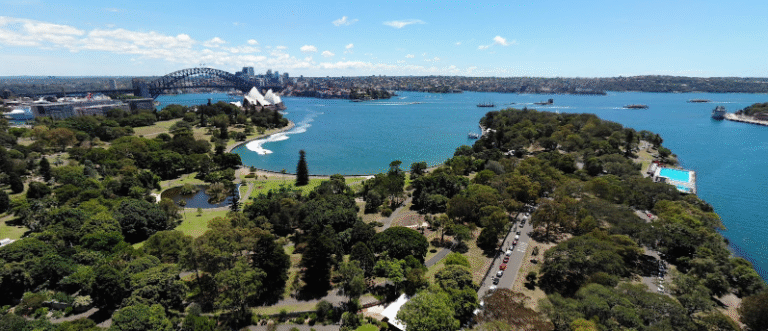 Aerial view of Mrs. Macquarie's Chair with Sydney Opera House and Harbour Bridge in the background, showcasing the stunning view for Seeing the Sunset from Mrs. Macquarie's Chair. Credit by Google Maps