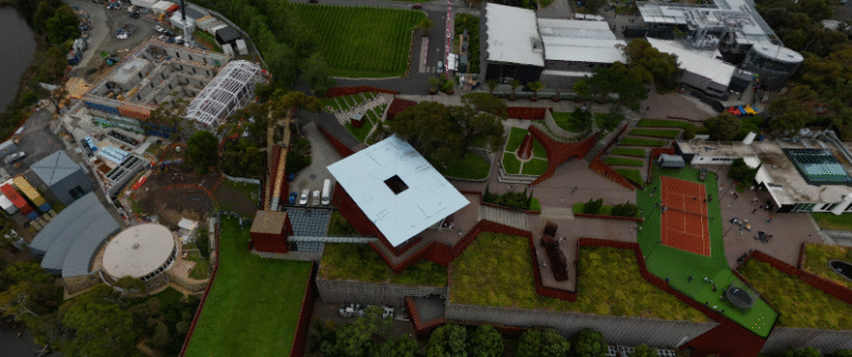 Aerial shot of Museum of Old and New Art (MONA) highlighting . landscaped gardens, buildings, and tennis courts. google map