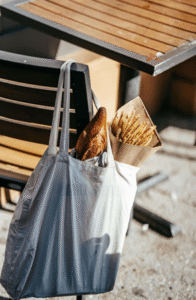 Freshly baked bread and snacks representing the taste of Tasmania, placed in a bag