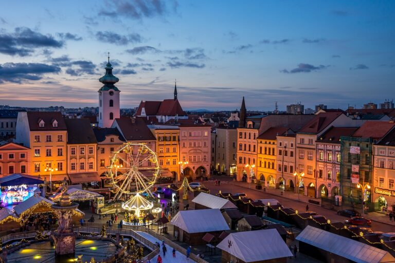 "A beautiful Christmas market scene with festive lights, a Ferris wheel, and visitors shopping for handcrafted goods during the holiday season. Tasmanian Craft Fair